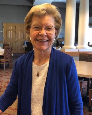 Lois Wishmeyer wearing a blue top smiling