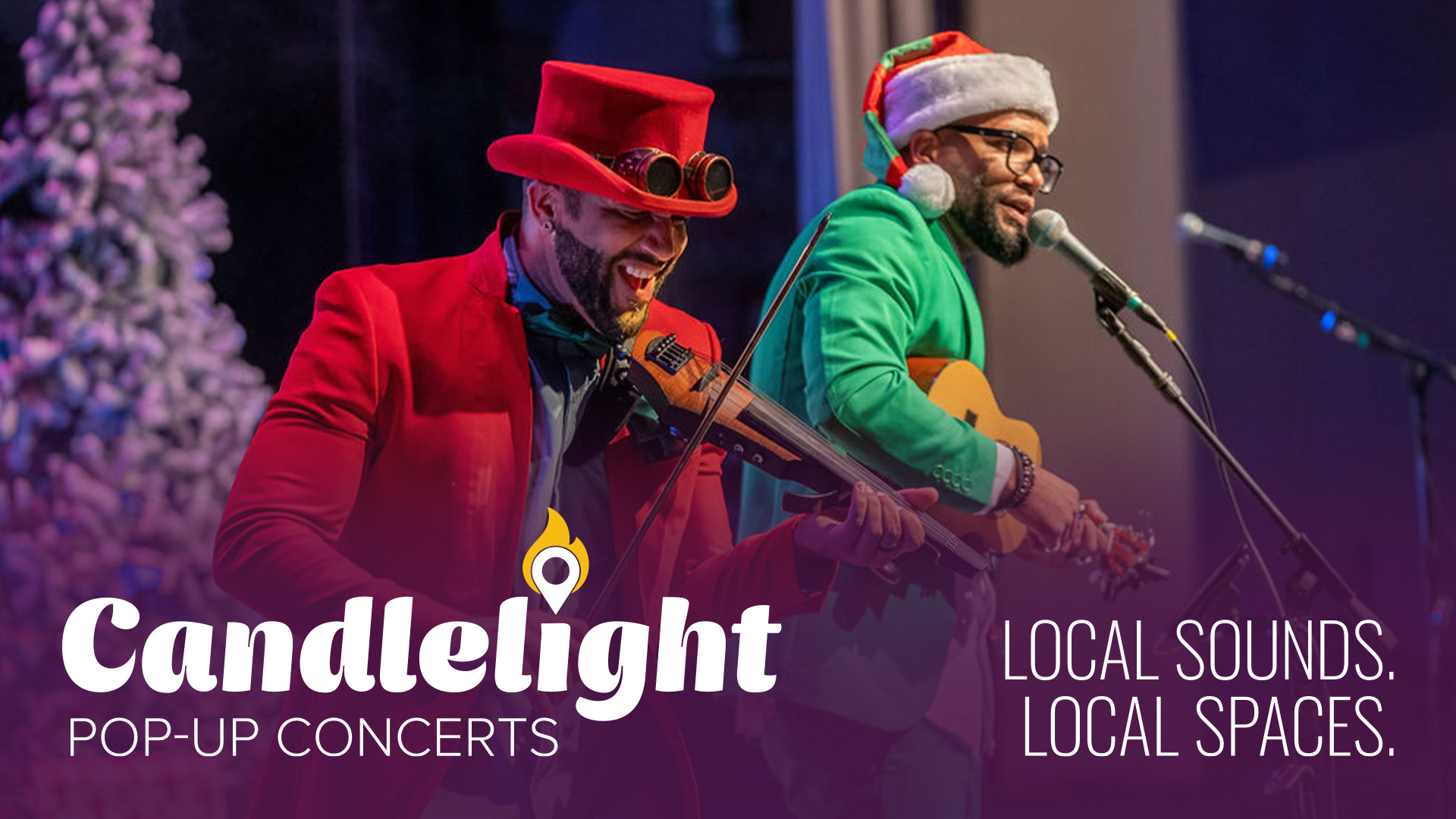 Two people playing in a band in christmas clothes and a santa hat singing