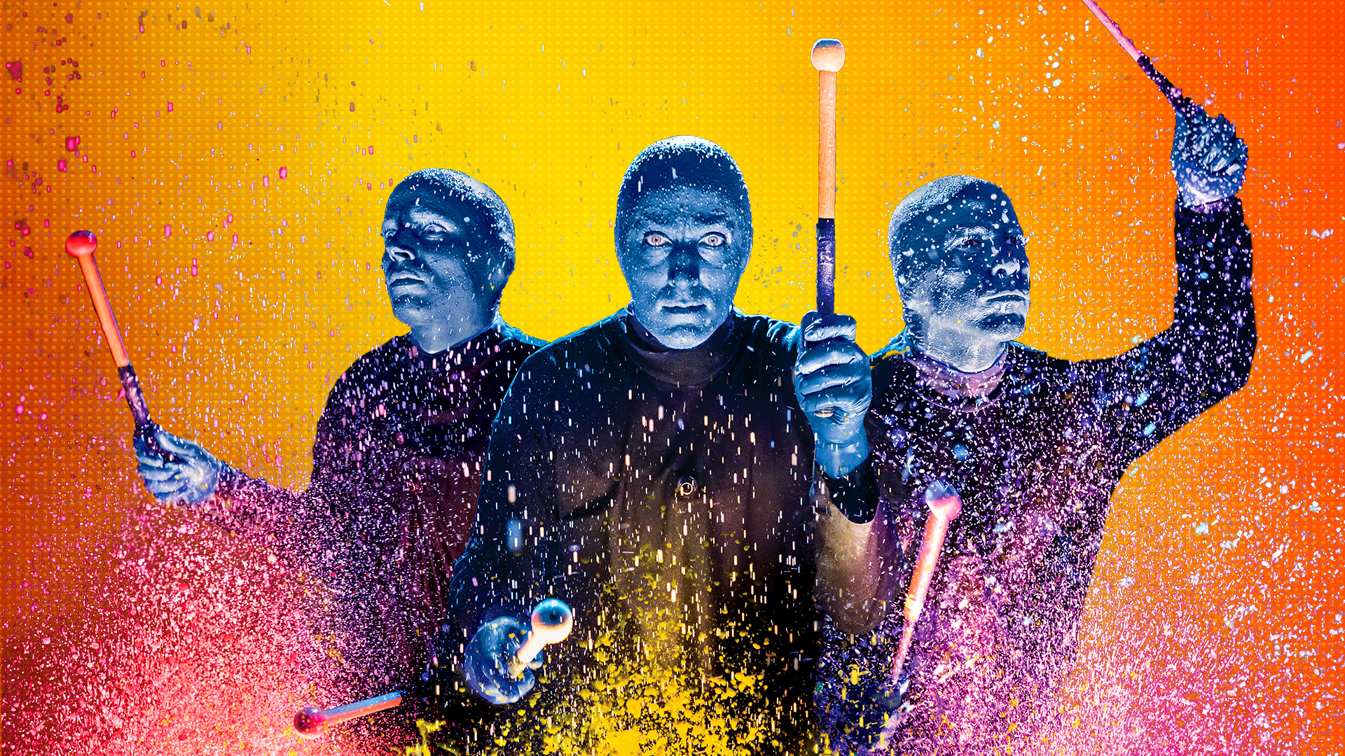 Blue Man Group on an orange and yellow background playing drums with paint