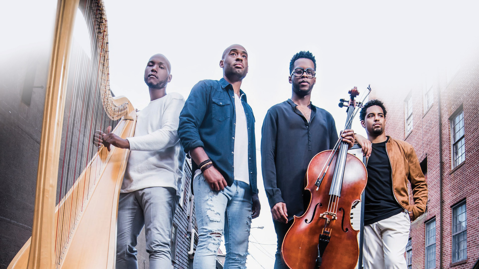 4 men standing with harp and string bass