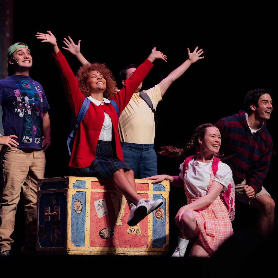 Performers in a children's show strike a final pose