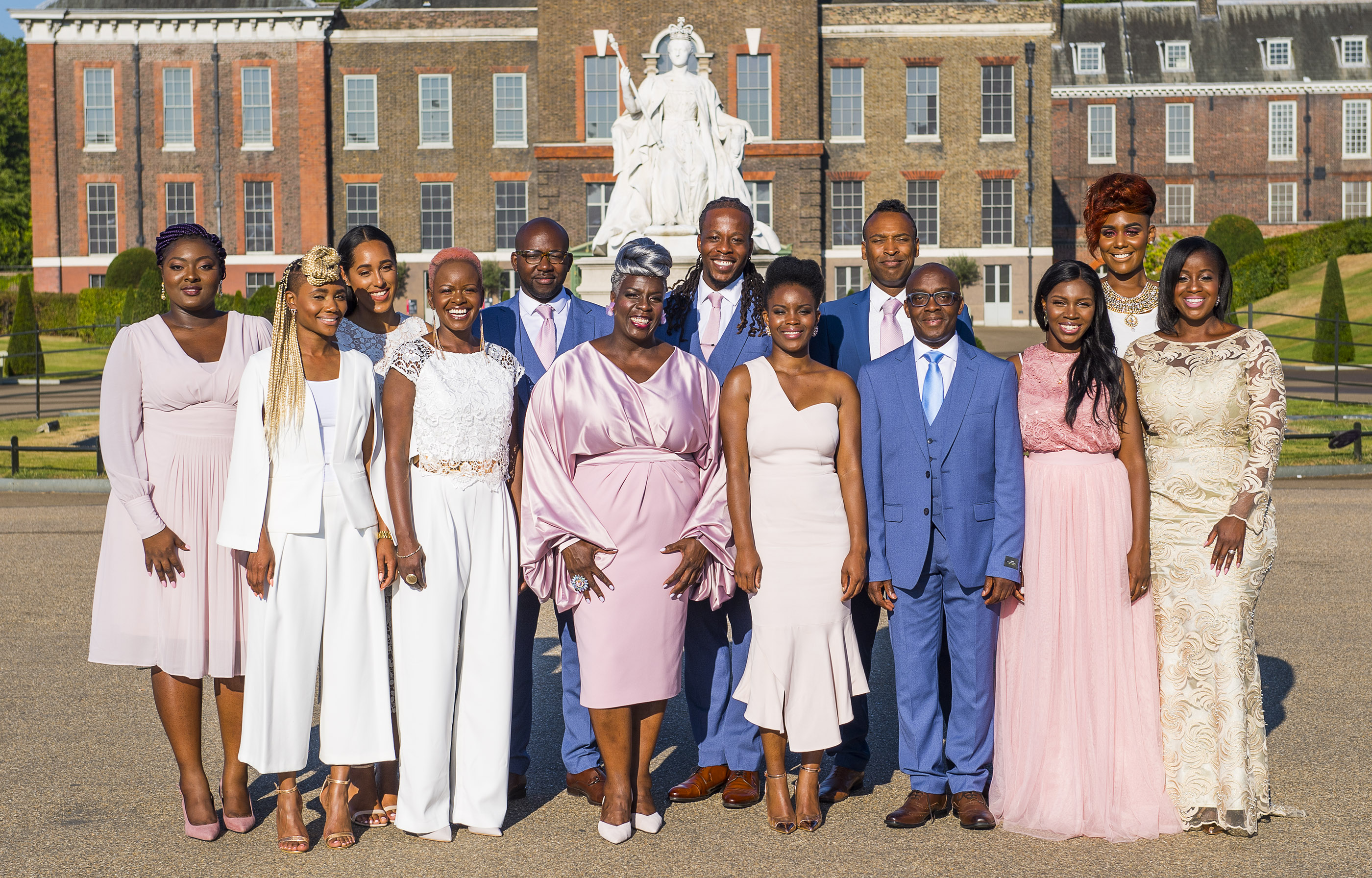 The Kingdom Choir stands in front of a building