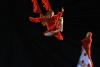 Dancer Swinging from ariel ribbons in red