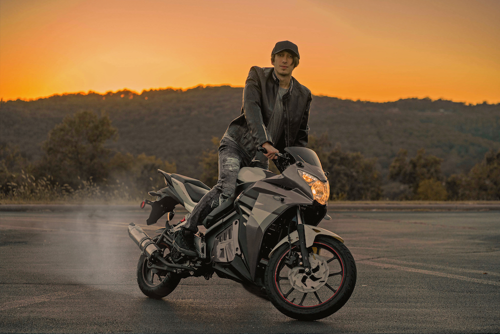 Reza on Motoercylce Headshot in front of sunset