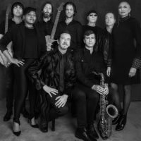 Black and white image of multiple band members