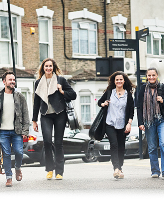 Elias String Quartet members walking on a street