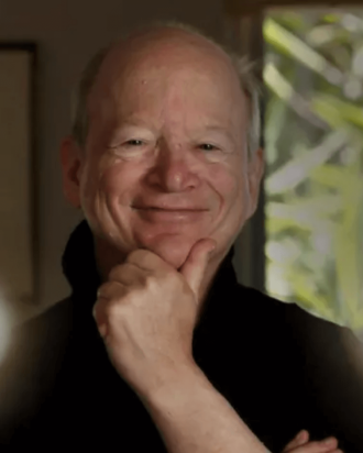 Bob Lefsetz smiling indoors.