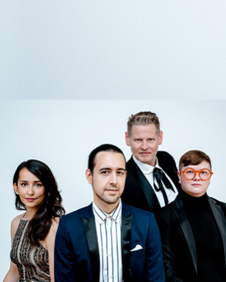 A group of people dressed up looking into the camera with a white background