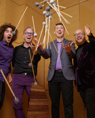 A group of guys dropping mallets towards the camera