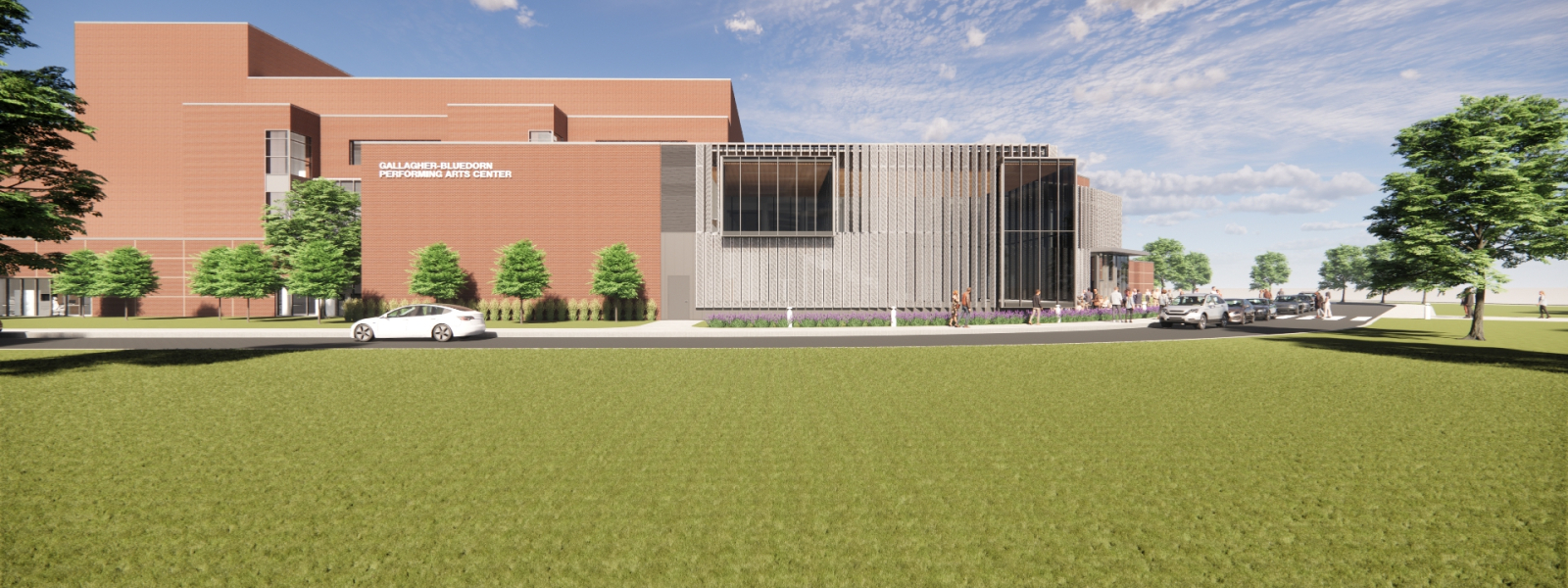 The side of the building with a large glass facade and expanded walkways. 
